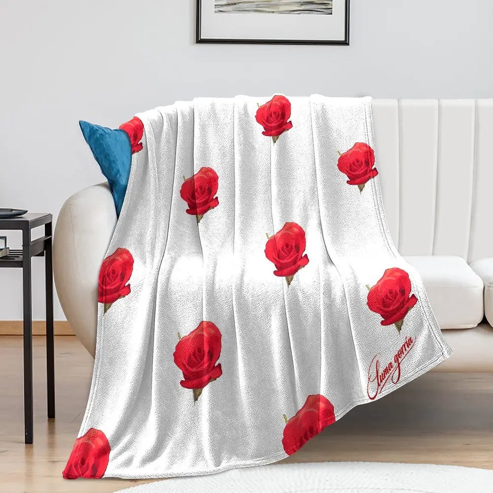 Couverture en Flanelle Ultra Douce – posé sur le canapé colorie blanche avec des fleurs