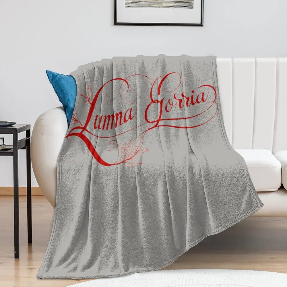 Couverture en Flanelle Ultra Douce – posé sur un canapé colorie grise